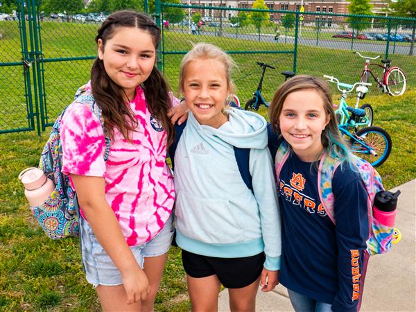 Students bike to school in the morning.